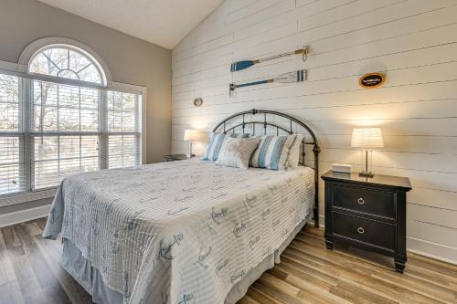a bedroom with a large bed and a window at Golf, Gamble and Fish! Condo with Pool in Little River in Little River
