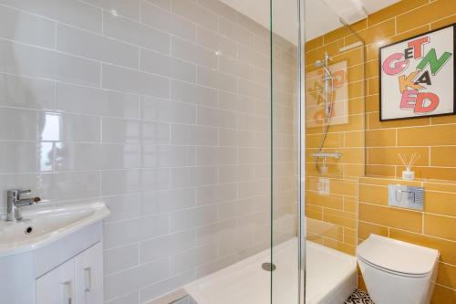 a bathroom with a shower and a toilet and a sink at 2 Bed in Lynton oc-lyncha in Lynmouth