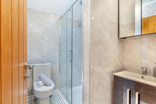 a bathroom with a toilet and a glass shower at 3 Bed in Yeolmbridge oc-t30293 in Werrington