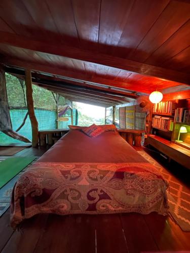 a bedroom with a large bed in a house at Open spacious house with stunning Peninsula view in Pavones