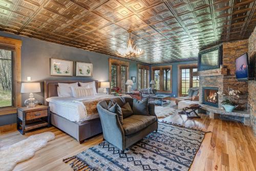 a bedroom with a bed and a fireplace at Abode at Open Meadows in Wilson