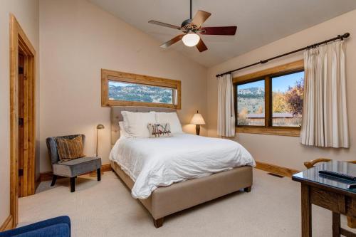 a bedroom with a bed and a ceiling fan at Abode at Sweetwater in Wilson