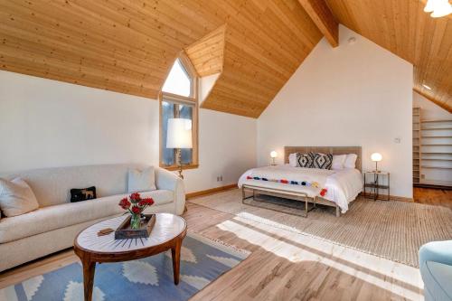 a living room with a bed and a couch at Abode at Golden Spruce in Wilson