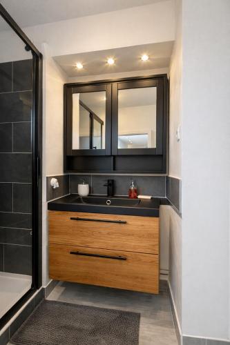 a bathroom with a sink and a mirror at Etrave in Toulon