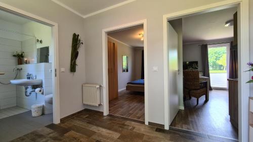a bathroom with a sink and a toilet in a room at 08 Heuwiese - Hof Wiesengrund in Parchtitz