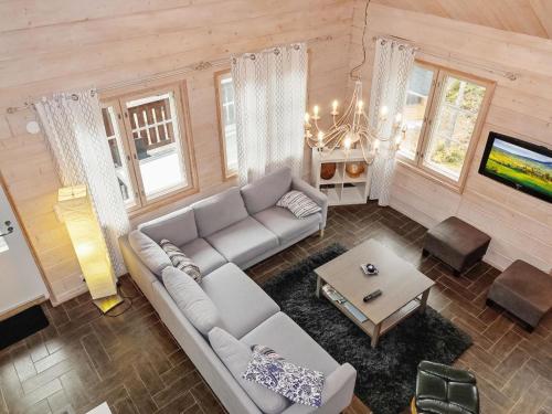 a living room with a couch and a table at Holiday Home Lux iii by Interhome in Salla