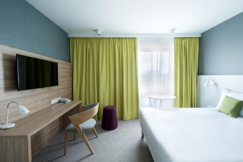 Posteľ alebo postele v izbe v ubytovaní ibis Styles Siedlce