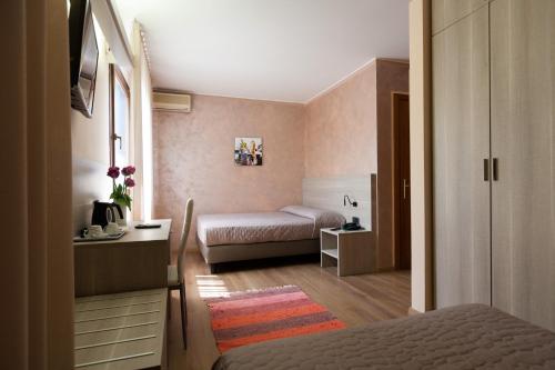 Postel nebo postele na pokoji v ubytování Hotel Prata Verde