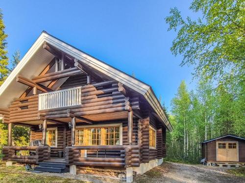 a log cabin cabin in the woods at Holiday Home Luppokero by Interhome in Salla