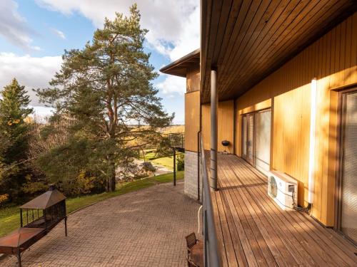 a porch of a house with a wooden deck at Pikk 45 in Otepää