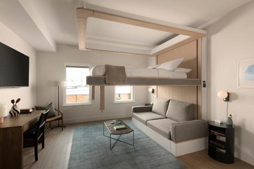 a living room with a bunk bed and a couch at Mint House Tampa Downtown by Kasa in Tampa