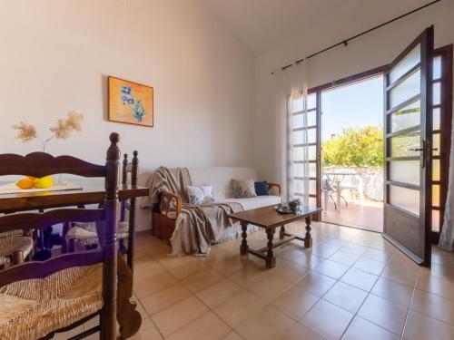 a living room with a couch and a table at Holiday Home D1 by Interhome in Deltebre