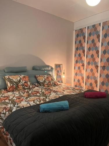 a bedroom with a large bed in a room at Great two bedrooms apartment with a private sauna and a sea view from the balcony close Helsinki center in Helsinki