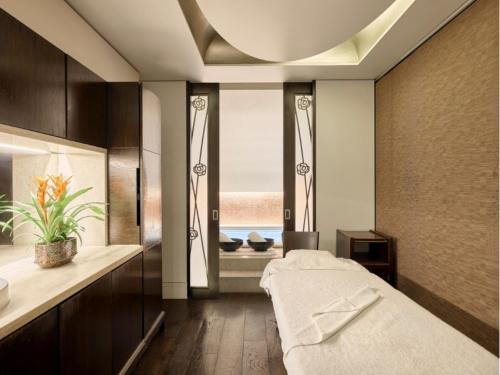 a bedroom with a bed and a window at Sofitel London St James in London