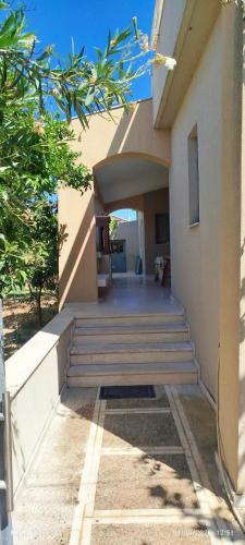 a house with stairs leading into a hallway at Zach's house in Nea Roda
