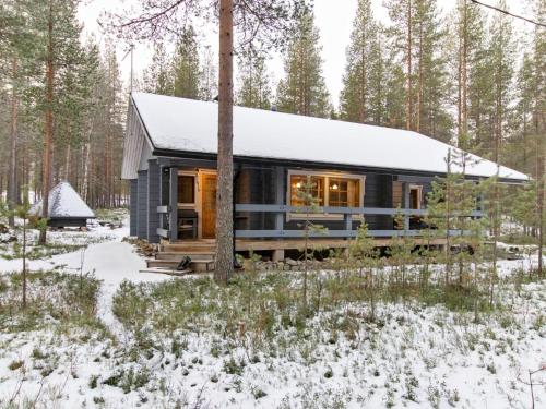 a house in the woods in the snow at Holiday Home Kuusenkolo by Interhome in Pyhätunturi
