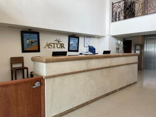 an entrance to a waiting room with a reception counter at Astur Hotel & Residence in Veracruz