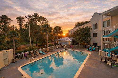 a large swimming pool in front of a building at Hotel Carolina in Hilton Head Island