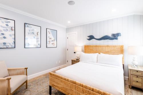 a bedroom with a bed and a desk and a chair at The Newport Lofts - 410 Thames Street in Newport