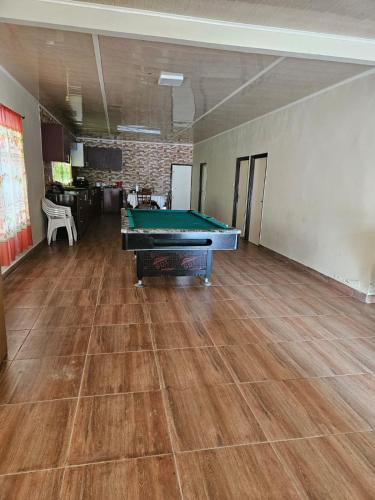 an empty room with a pool table in it at The Green Lounge in Baskamp