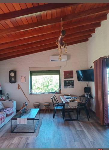 a living room with a couch and a table at Cabaña Panambi in Villa Serrana