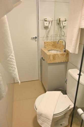 a bathroom with a toilet and a sink at Nobile Stays Ininga in Teresina
