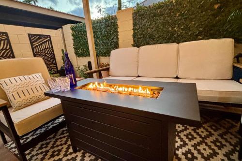 a fire pit on a patio with a couch at Old Town | Pool | BBQ | End Unit | Pet in Scottsdale