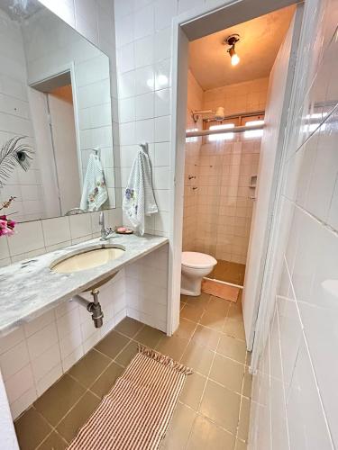 a bathroom with a sink and a toilet at CASA in Piranhas