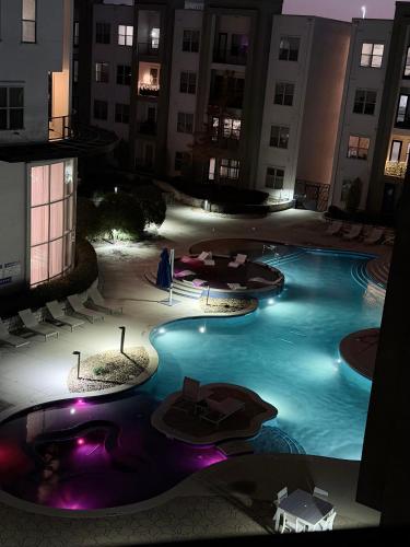 an empty pool in a hotel at night at FIFA WORLD CUP! POOL VIEW! Near Dallas Love Field! Medical District! Downtown Dallas! in Dallas