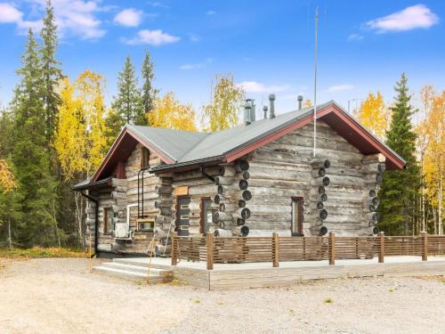a log cabin with a metal roof at Holiday Home Kojamopirtit by Interhome in Kolari