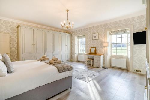 a bedroom with a large bed with a teddy bear on it at 4 Bed in Armathwaite oc-e34641 in Armathwaite