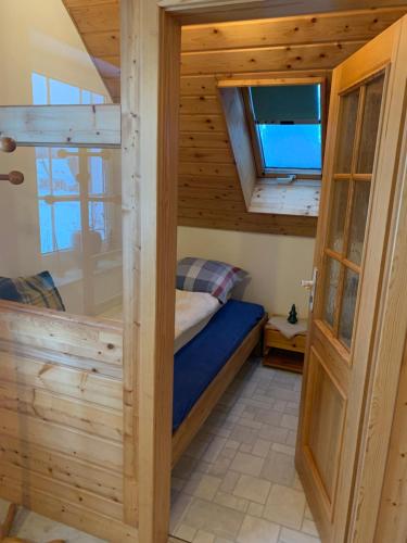 a small bedroom with a bunk bed in a house at Mein Sauerland in Medebach