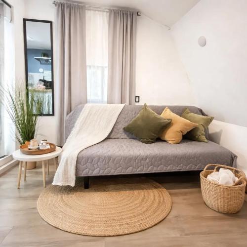a living room with a couch and a table at Social Distanсing Approved Nature Getaway! in Naples