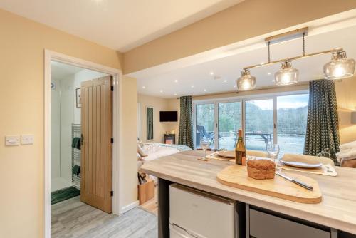 a kitchen with a counter with a cutting board on it at 1 Bed in Far Forest oc-d30808 in Rock