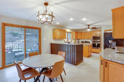 a kitchen and dining room with a table and chairs at Game Room and Covered Patio Hummelstown Hideaway in Hummelstown