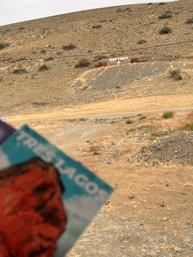 a book sitting on the side of a dirt road at frente del mirador in Tres Lagos