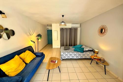 a living room with a couch and a bed at Ti Turtle in Saint-François