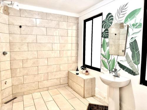 a bathroom with a toilet and a sink at Hotel Mandacarú Puerto Viejo in Puerto Viejo