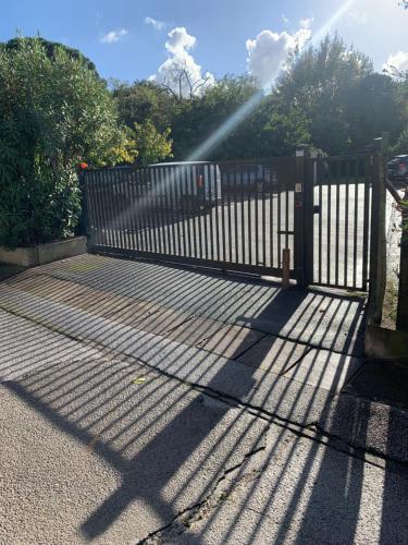a gate with a beam of light shining on it at Studio Saint-Tropez Heraclée in Saint-Tropez