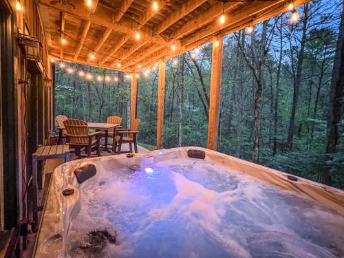a jacuzzi tub in the middle of a house at Mountain Hideaway - Hot Tub, Fire Pit, Close to Town in Ellijay