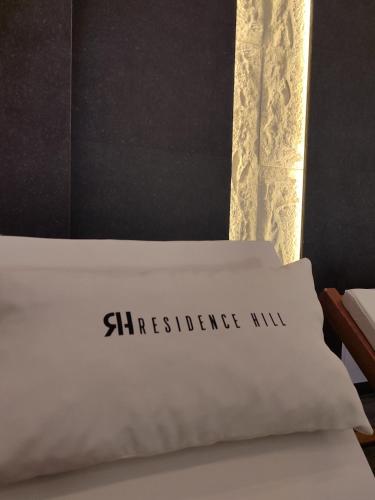 a white bed with the words mattress mix on it at Yellow Hill Apartment in Cajetina
