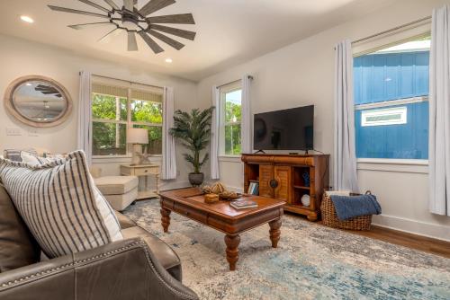 a living room with a couch and a coffee table at Lavender Haze - 1209 Chaumont in Dauphin Island