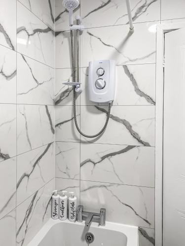 a bathroom with a shower and a sink at New Manchester Getaway Home - Free Gated Parking with Fob in Manchester
