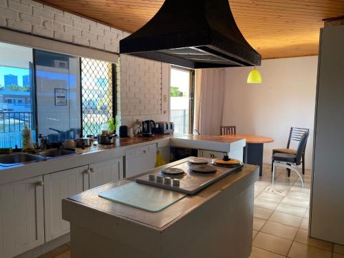 a kitchen with a sink and a counter top at Exclusive Sunrise Room, GC Blues Festival, Cool Autumn, Fire Pits, Fishing in Gold Coast
