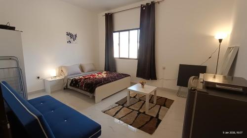 Ліжко або ліжка в номері Abu Dhabi Studio