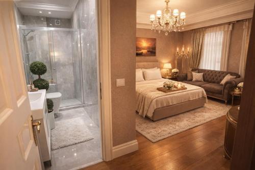 a bedroom with a bed and a living room at valide-maide hotel in Istanbul