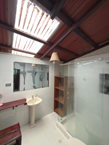 a bathroom with a sink and a glass shower at Casa Selva in El Valle