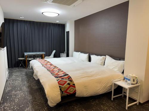a bedroom with a large bed in a room at Shiba inn in Tokyo