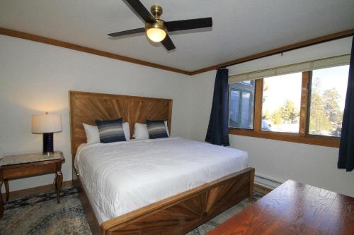 a bedroom with a bed with a ceiling fan at Mountainback 116 LoftCorner in Mammoth Lakes