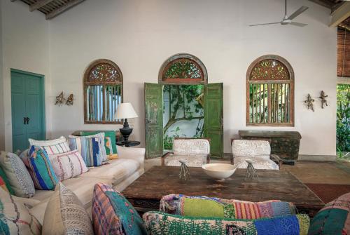 a living room with a couch and a table at Samudra Beach Villa in Habaraduwa Central